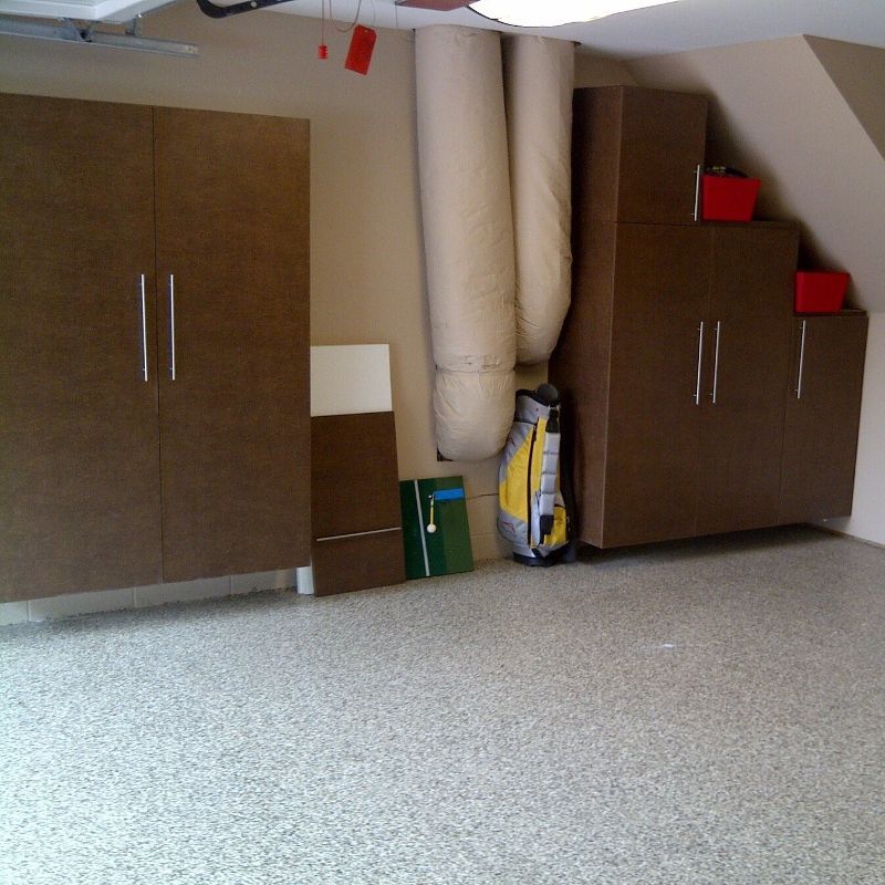 A garage with a golf bag in the middle of it