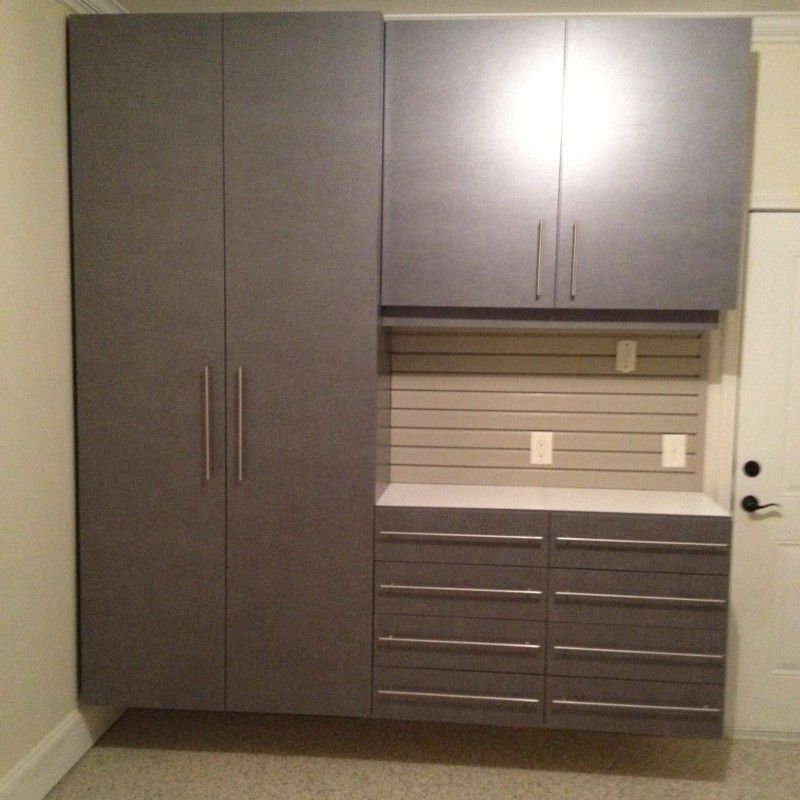 A room with a lot of cabinets and drawers