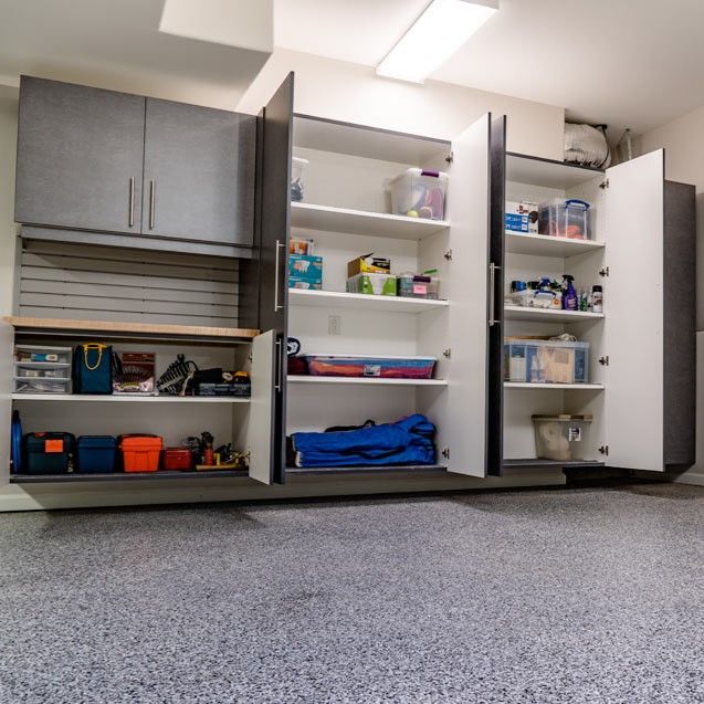 A garage filled with lots of shelves and cabinets