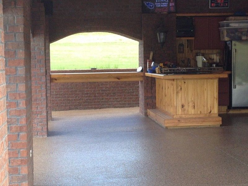 There is a wooden bar in the middle of the room.