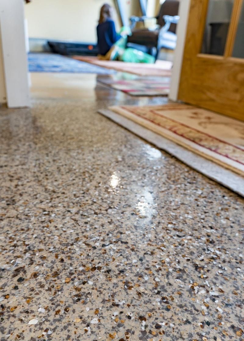 A close up of a marble floor in a living room.