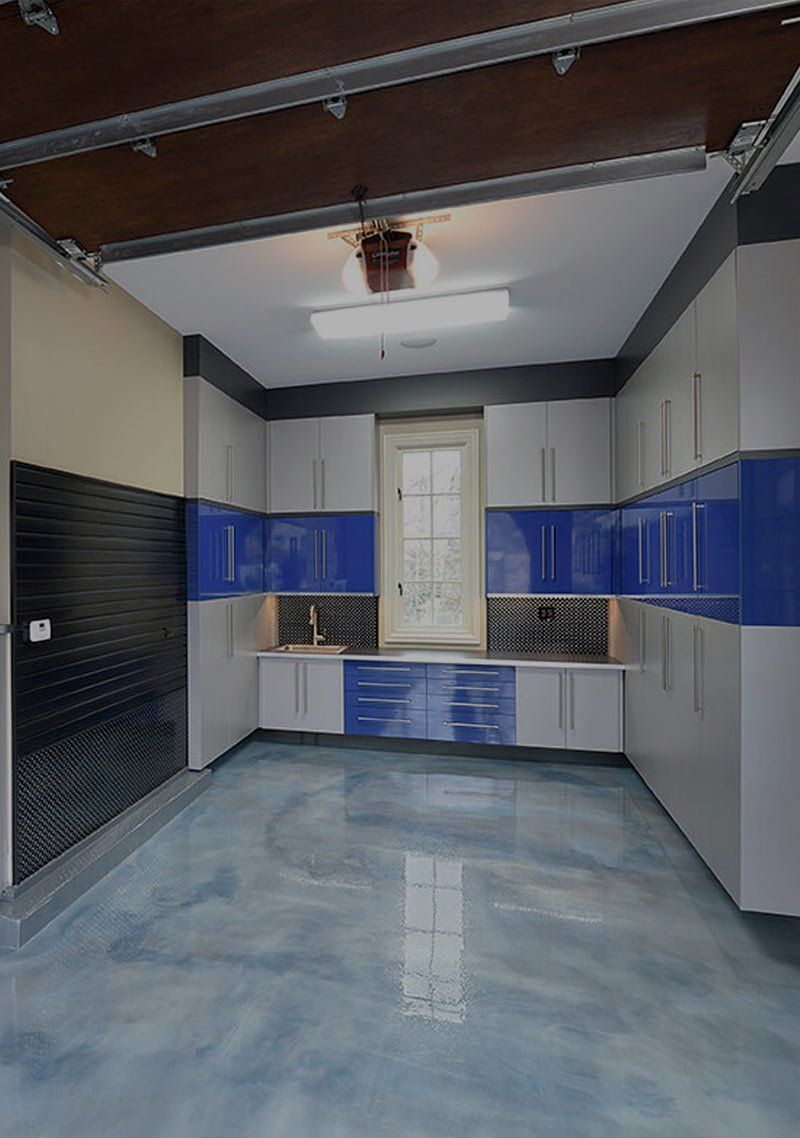 A kitchen with blue cabinets and a ceiling fan