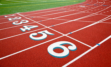 A red track with white lines and numbers on it