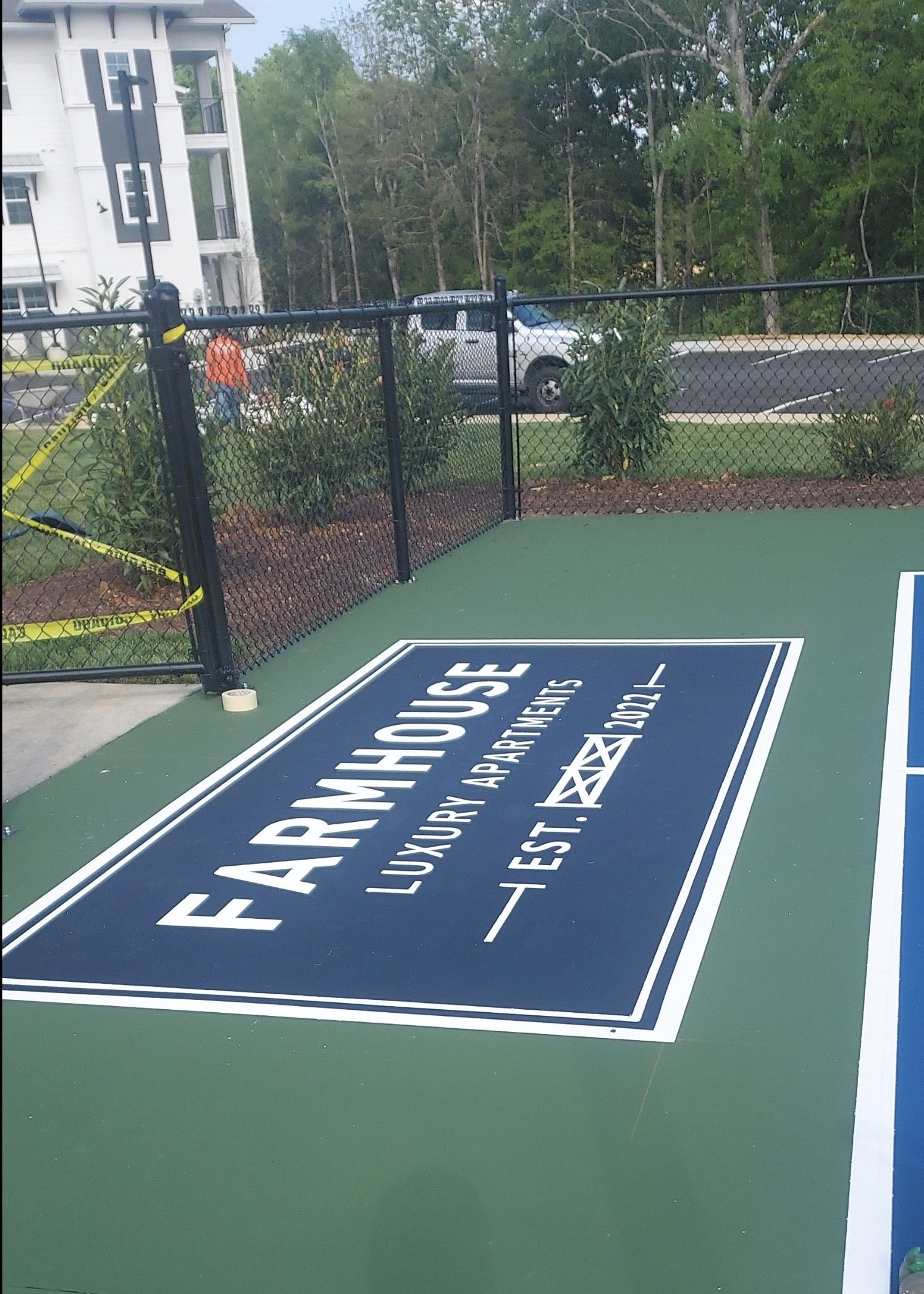 A basketball court with a sign that says farmhouse