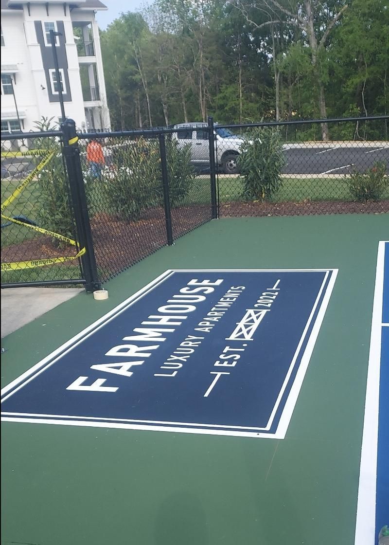 A basketball court with a sign that says farmhouse