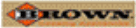 A blurred image of a wooden sign with the word downtown on it.