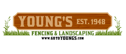 A wooden sign for young 's fencing and landscaping