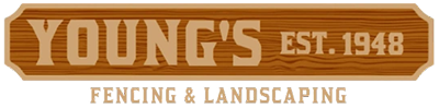 A wooden sign for young 's fencing and landscaping