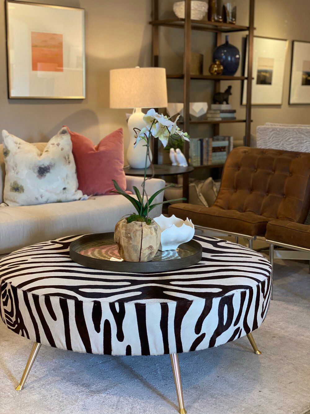 A living room with a zebra print coffee table