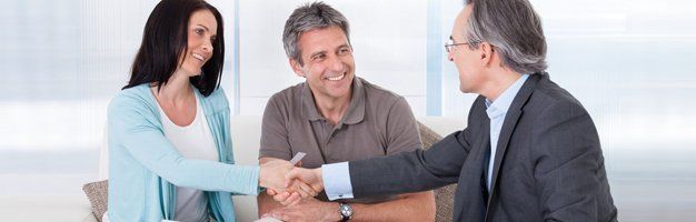 Couple talking with insurance agent