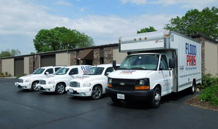 Learn More About Us Flood Pros' service trucks