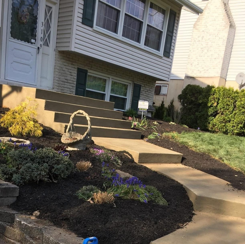 A house with stairs leading up to the front door