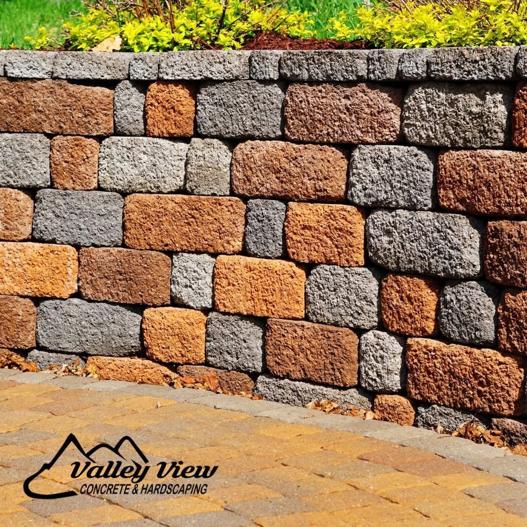 A brick wall with a logo for valley view concrete and hardscapes