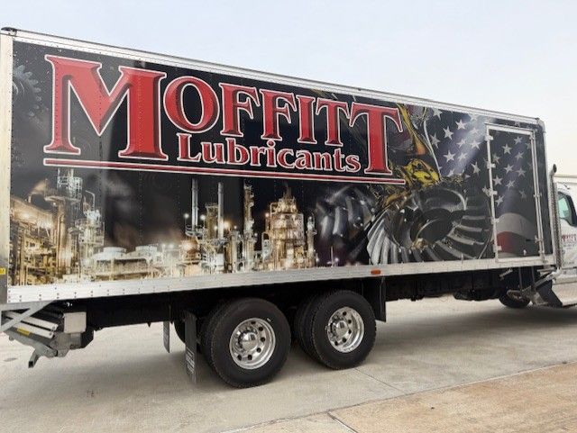 Moffitt Lubricants truck with company logo and detailed imagery on its side, outdoors.