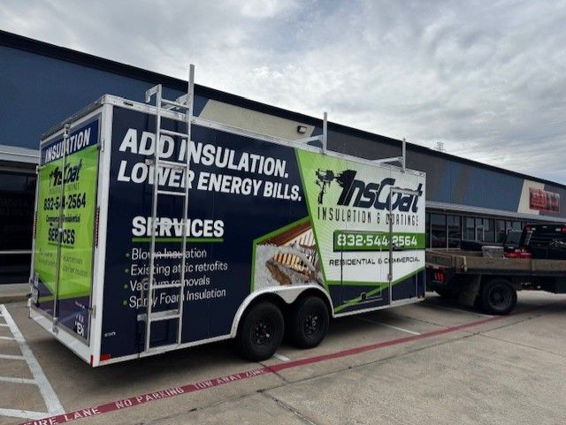 InsCoat trailer in front of a building with a black truck. The trailer has services and contact information on it.