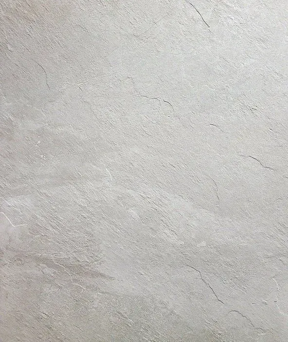 Close-up of a light gray textured surface with subtle diagonal streaks