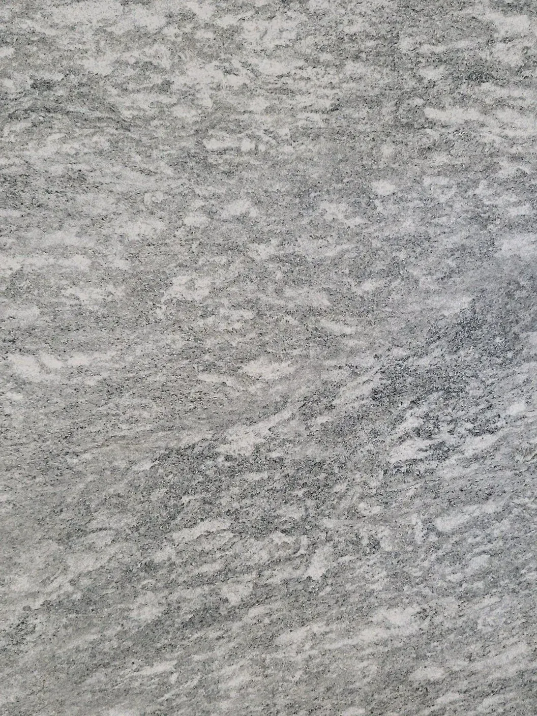Close-up of a gray textured surface with a mottled pattern
