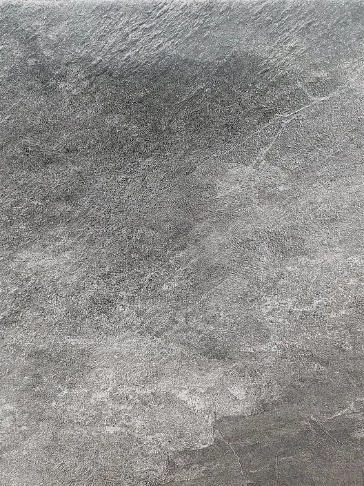 Gray textured stone surface with cloudy marbled patterns