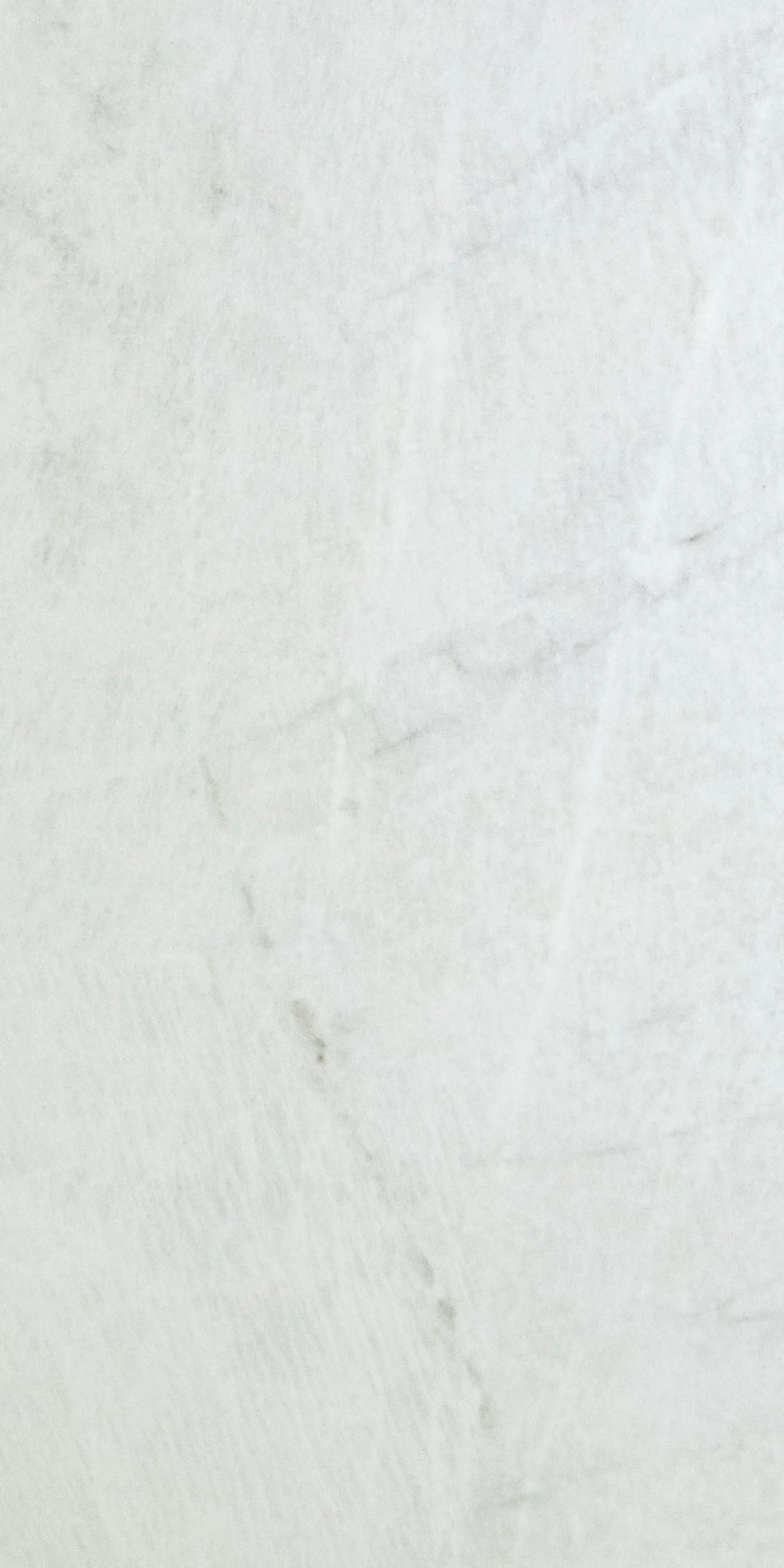 Light gray textured paper background with faint diagonal creases