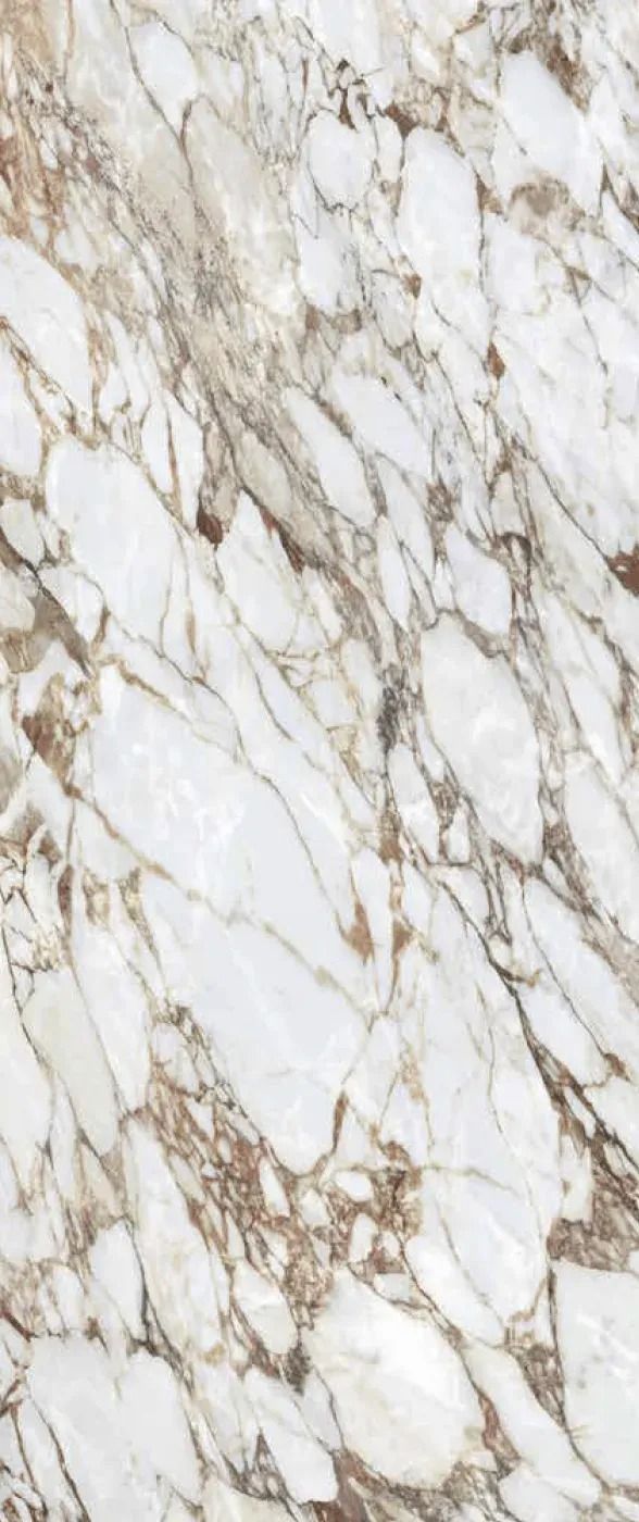 White marble surface with gray and gold veining, textured tile pattern