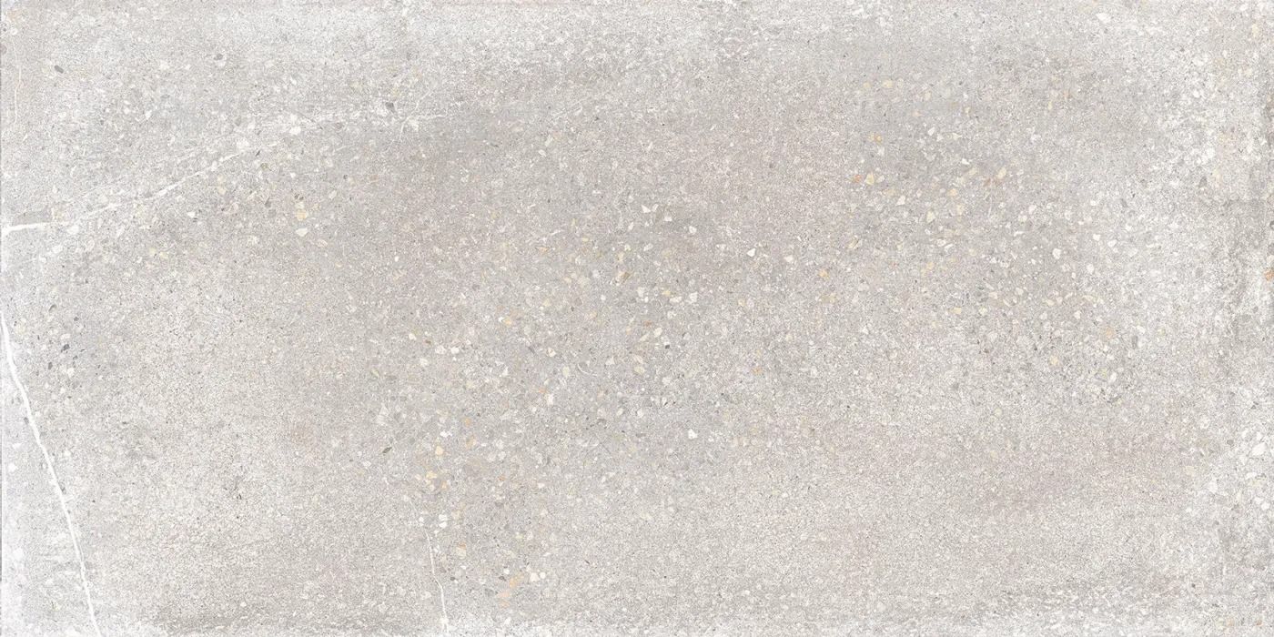 Close-up of a light gray, speckled textured surface with a faint horizontal seam.
