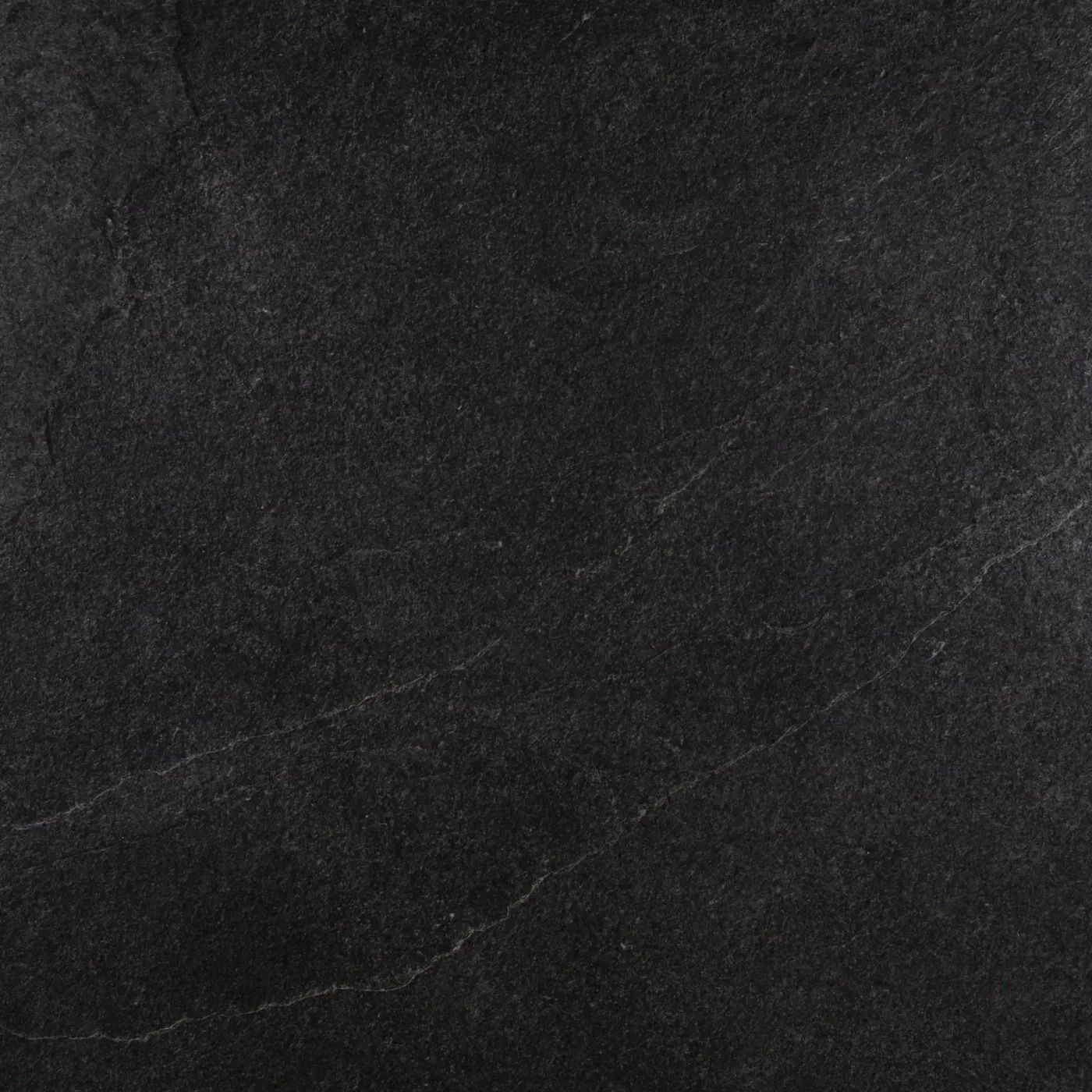 Dark gray textured surface with faint diagonal streaks
