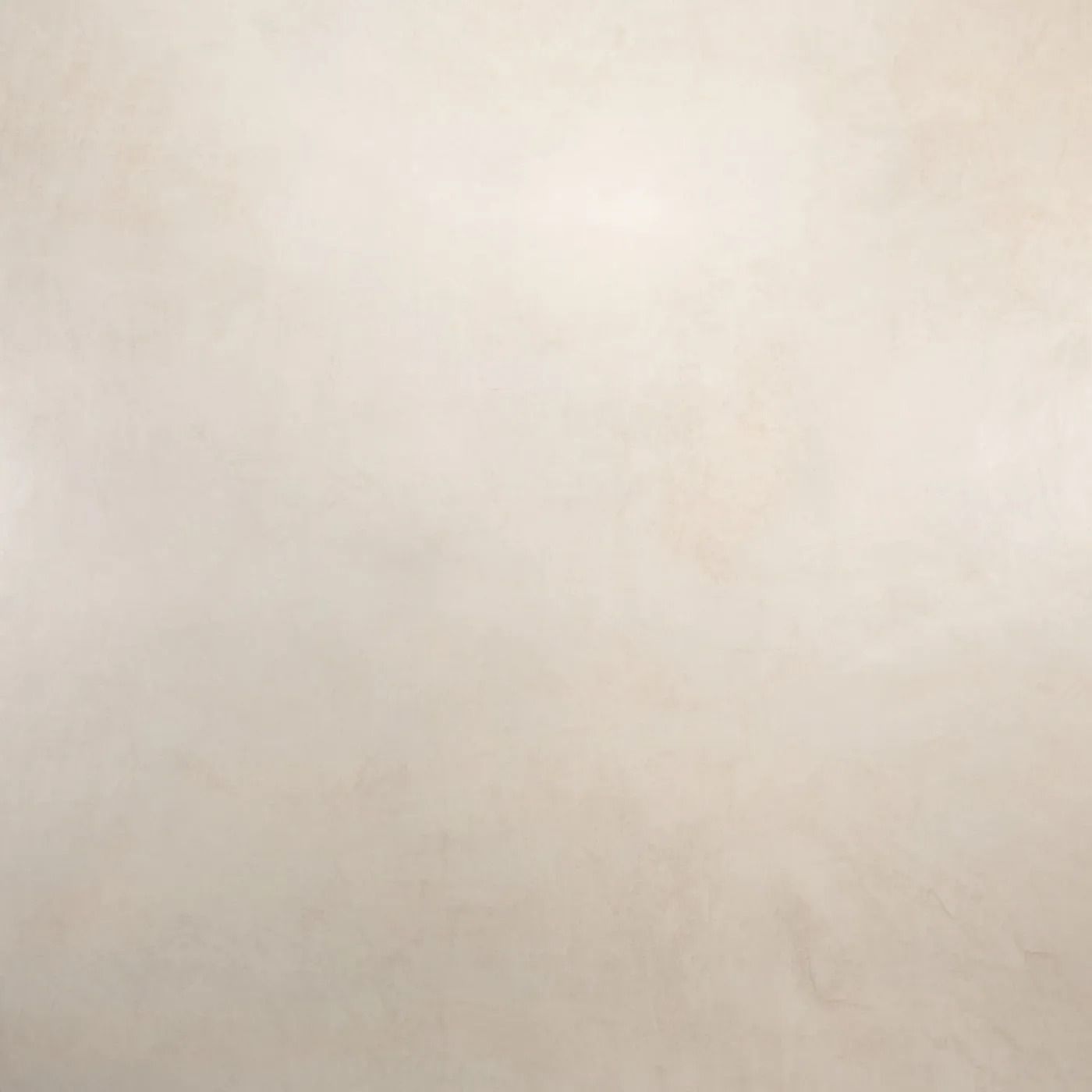 Plain beige textured surface with faint shadows and no distinct objects