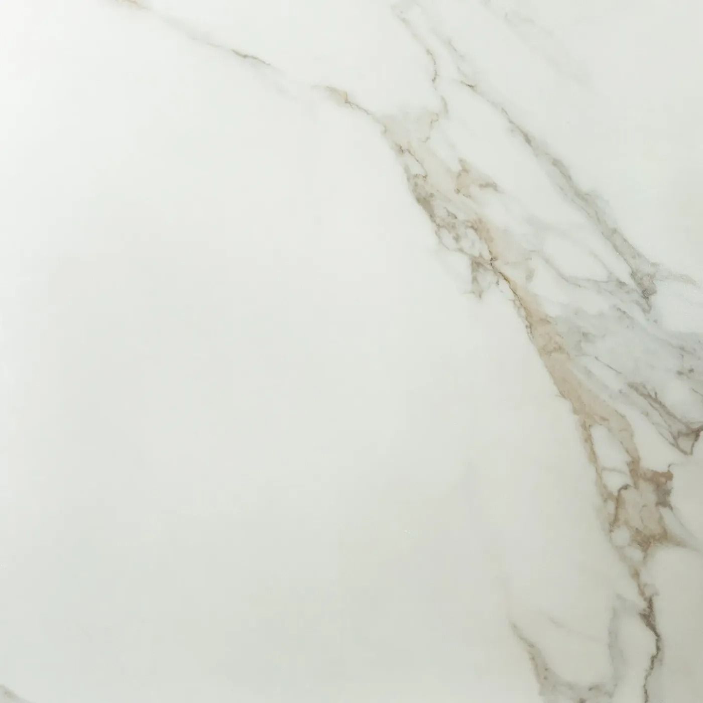 White marble surface with soft gray and gold veining.