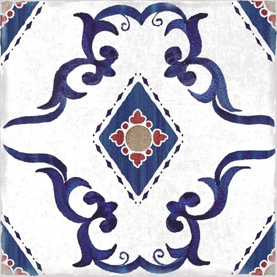 Blue and white decorative tile with a central floral medallion and ornate curved motifs