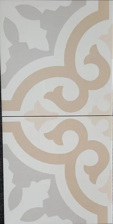 White and beige decorative tile pattern with swirling floral motifs and a horizontal seam