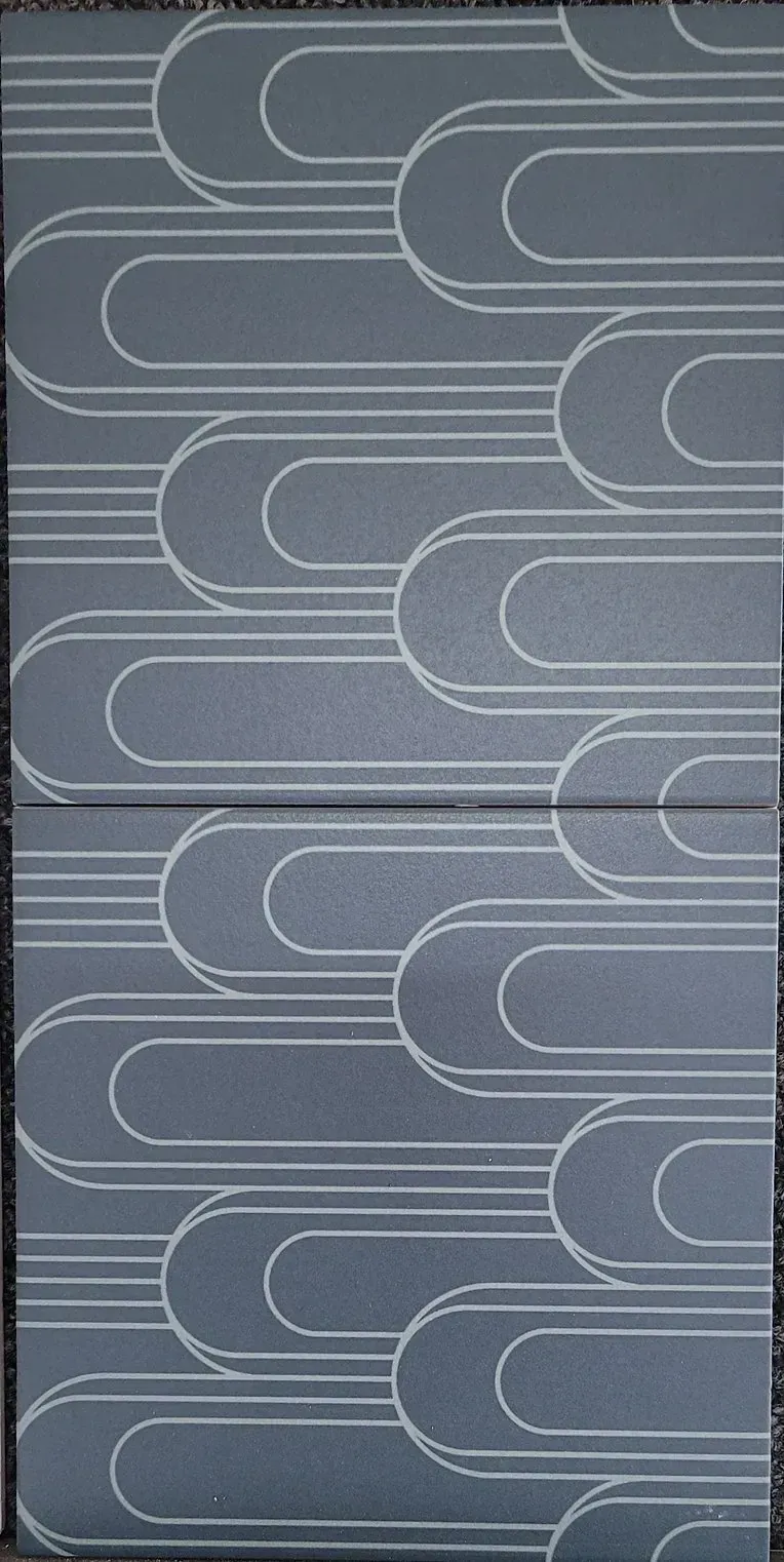 Gray abstract pattern of overlapping rounded lines and rectangles on textured fabric or wallpaper