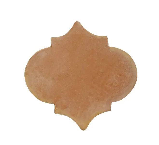 Brown decorative quatrefoil cutout on a white background