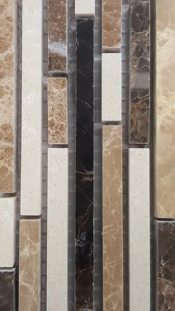 Vertical mosaic tile pattern in beige, brown, white, and black stone strips