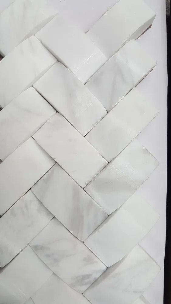 Close-up of a white woven paper or fabric texture with a basket-weave pattern