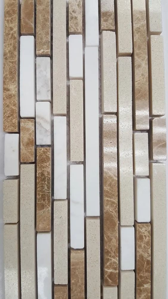 Vertical mosaic tiles in white, beige, and brown with glossy and textured finishes