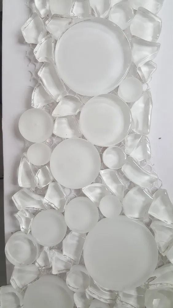 Clear glass mosaic with frosted circular tiles in white and transparent tones