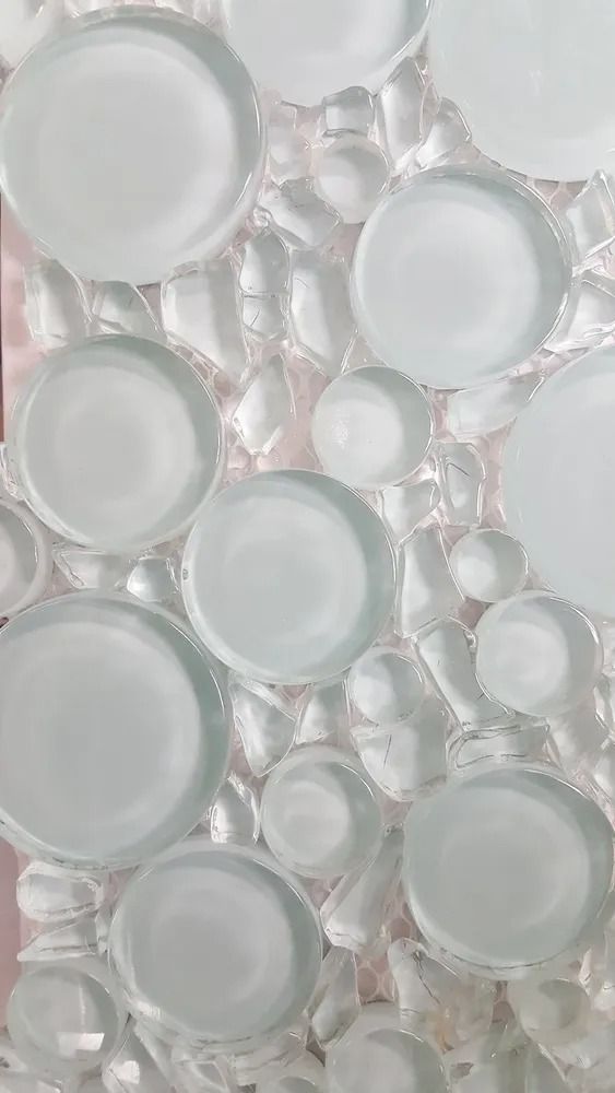 Translucent bubble wrap sheets with large and small air pockets on a pale background