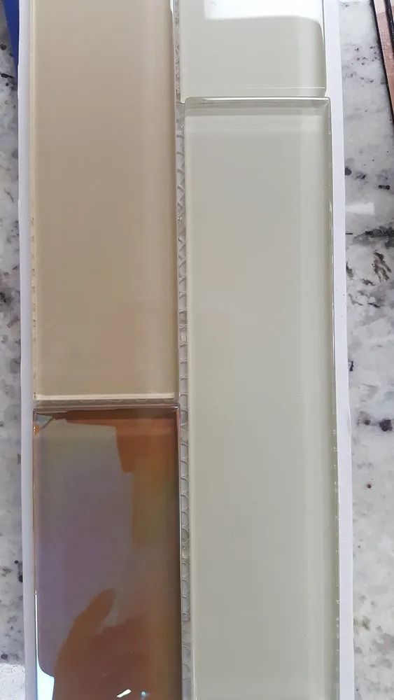 Close-up of beige and white rectangular containers stacked side by side