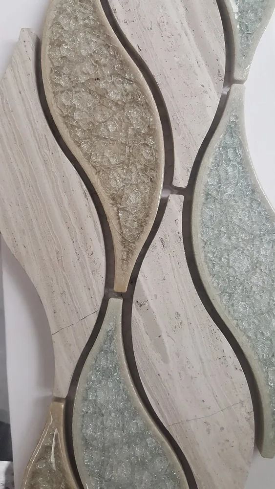 Abstract decorative wall tiles with wavy beige, gray, and green textured panels.