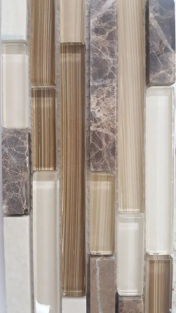 Vertical mosaic tile pattern in beige, gray, white, and brown tones