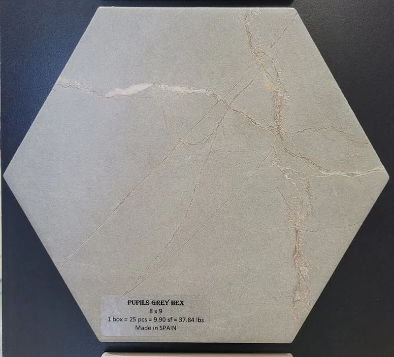 Hexagonal beige tile sample with subtle veining on a dark background, labeled near the bottom.