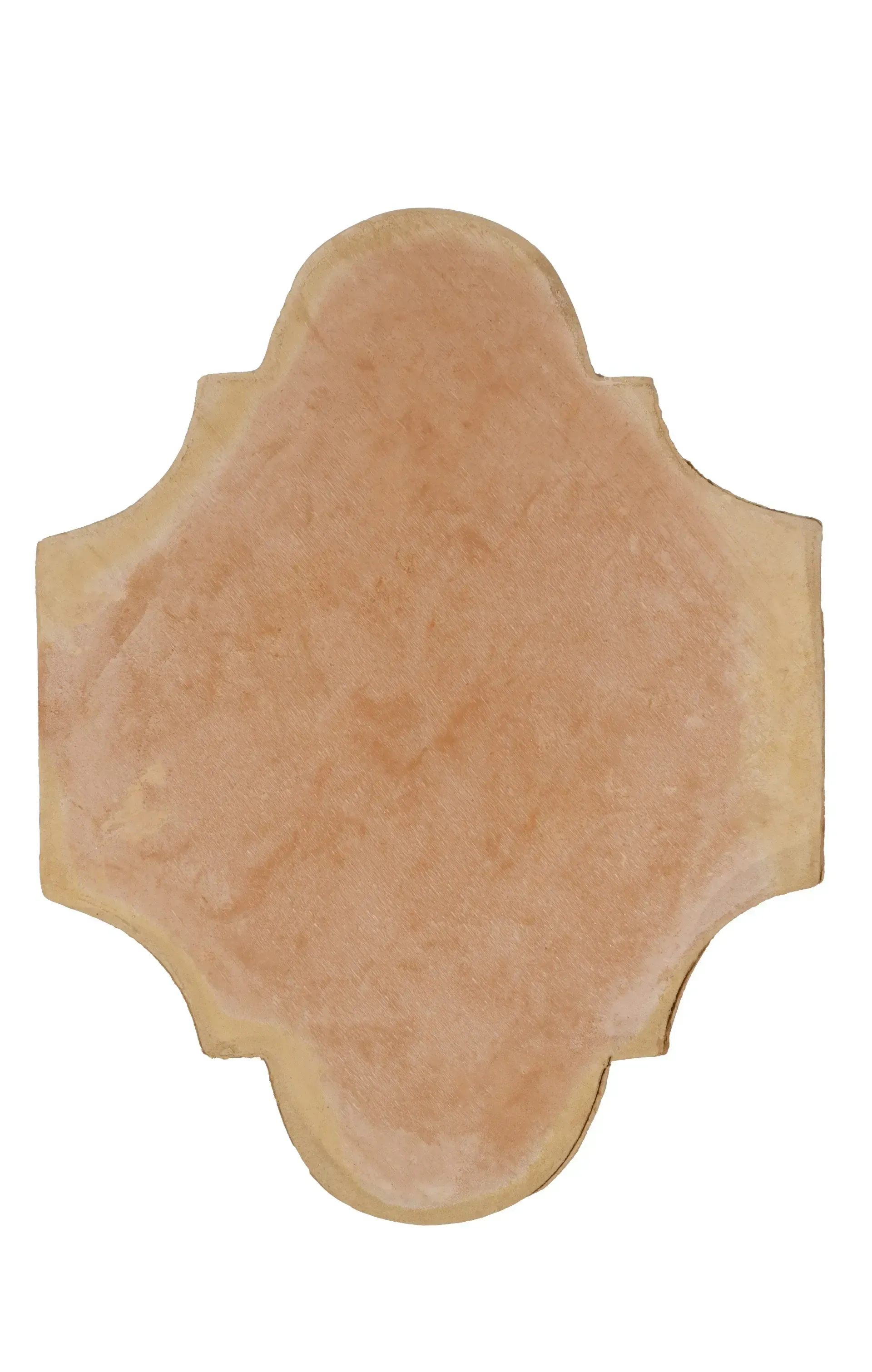Beige decorative plaque with scalloped edges on a white background
