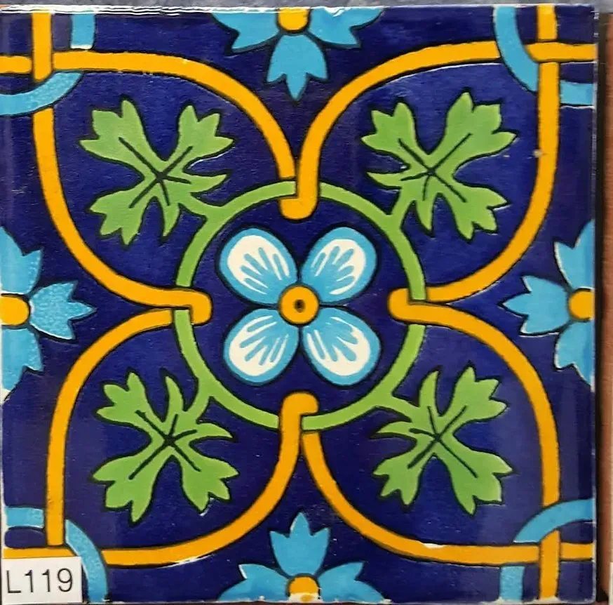 Blue, yellow, and green floral tile pattern with symmetrical four-petal design