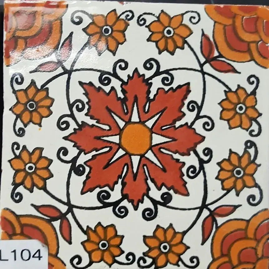 Orange and red floral tile pattern with black swirls and a central flower motif
