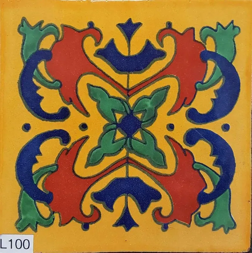 Colorful symmetrical floral tile pattern in blue, green, red, and yellow on a golden background