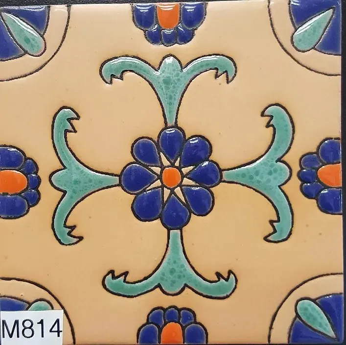Beige ceramic tile with blue, teal, and orange floral geometric pattern