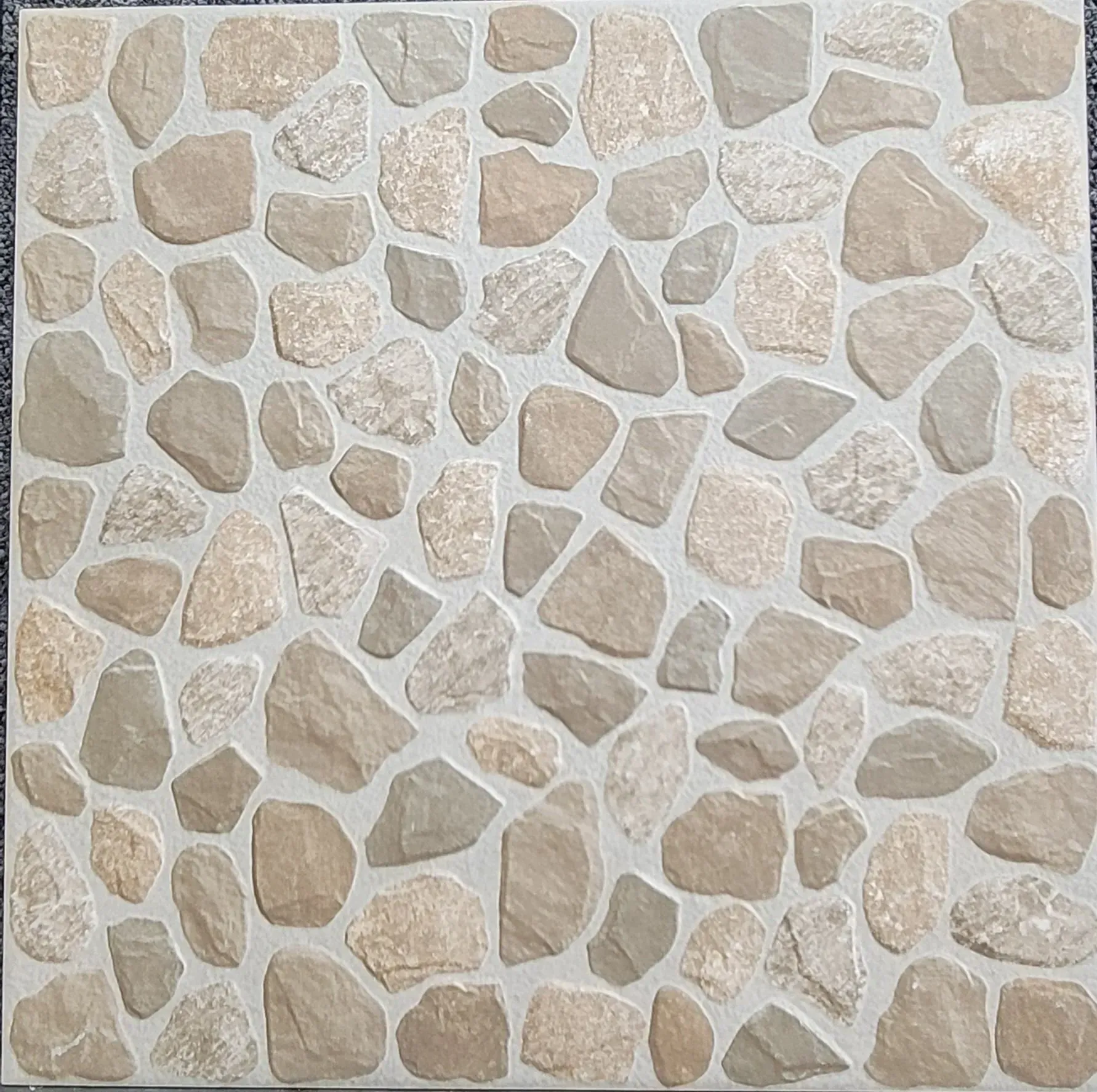 Beige and white irregular stone tile pattern on a wall or floor surface