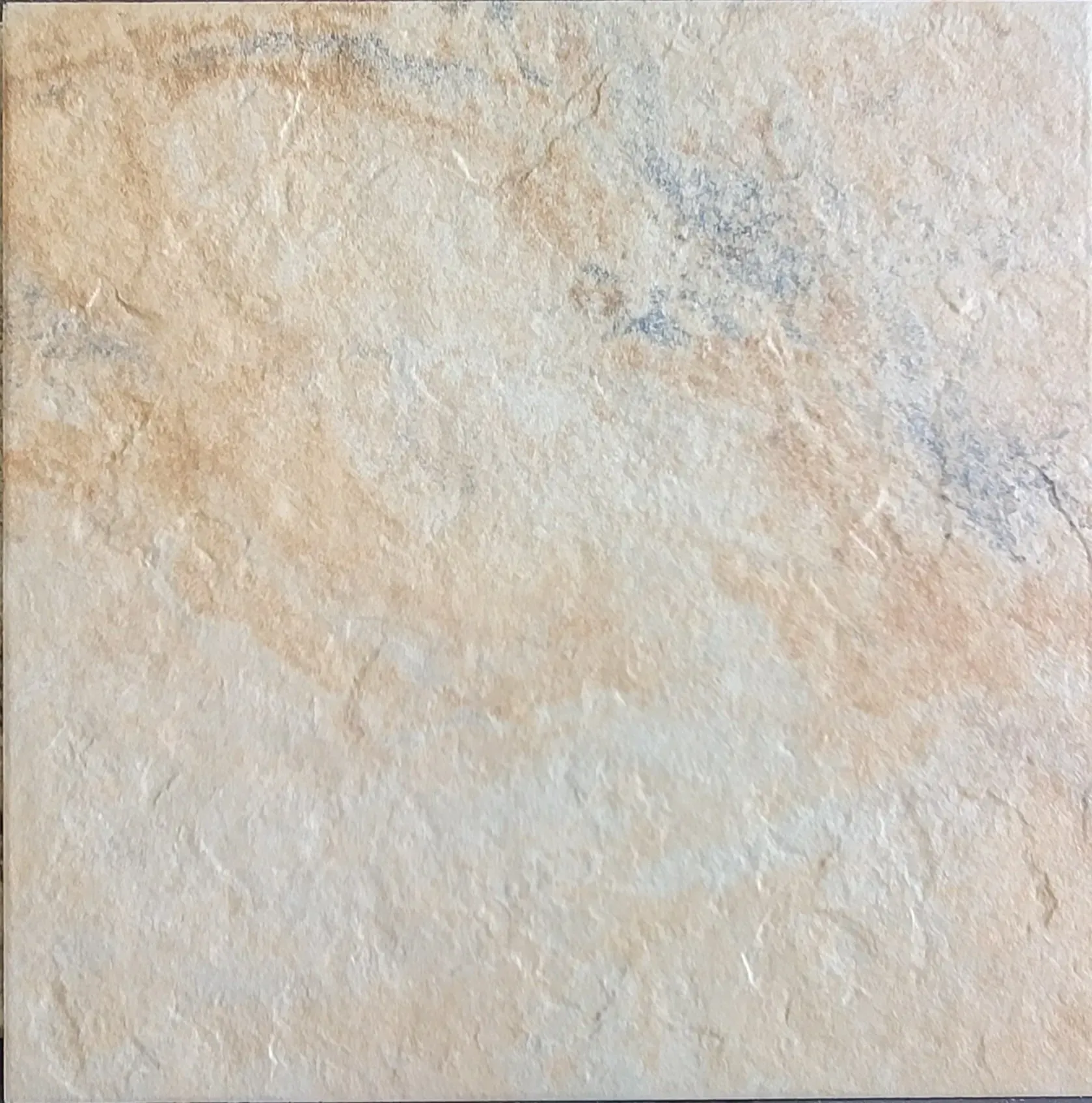 Beige textured stone or plaster surface with subtle gray and tan mottling