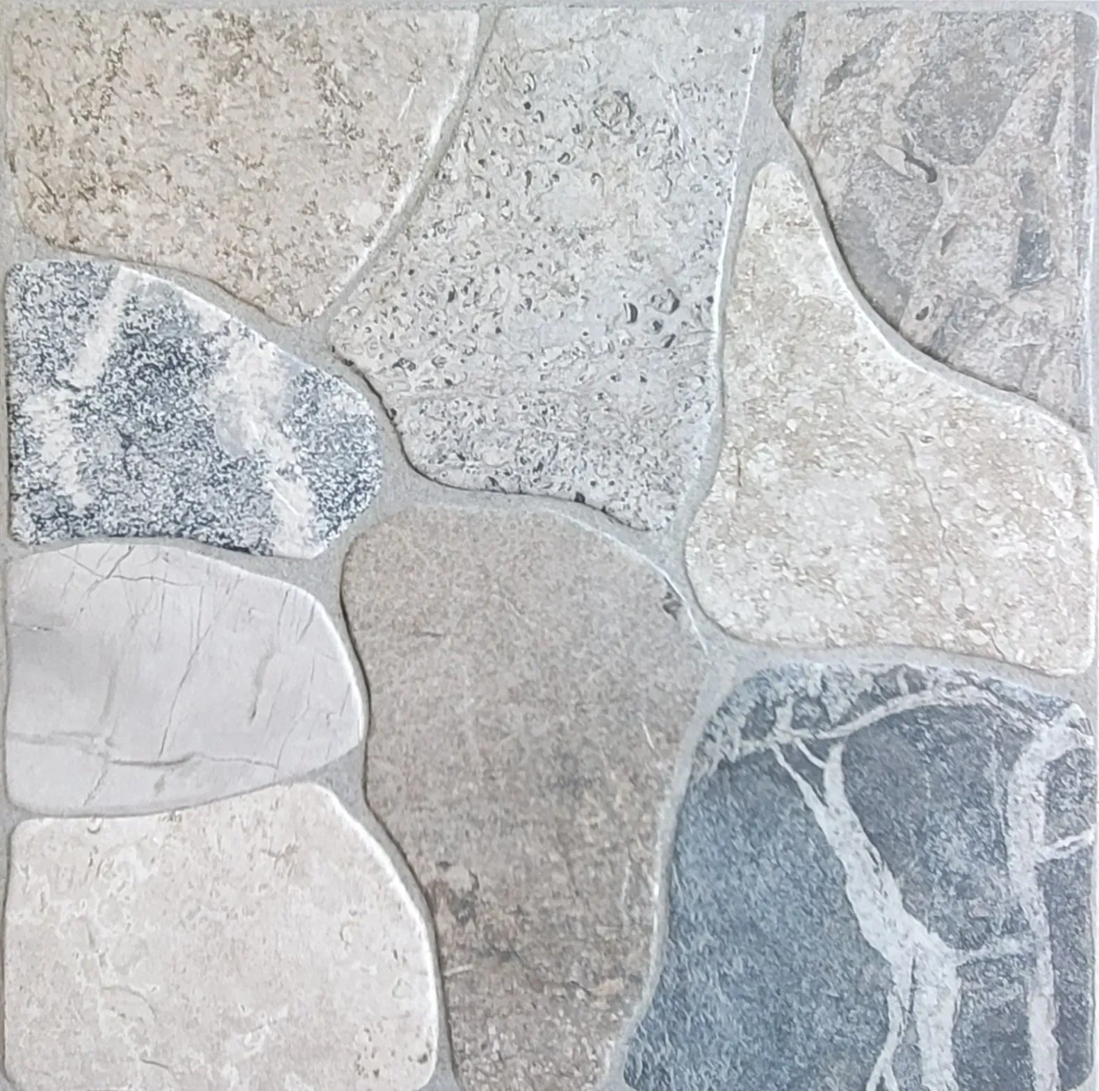 Light gray and blue mosaic stone tile pattern with irregular rounded shapes