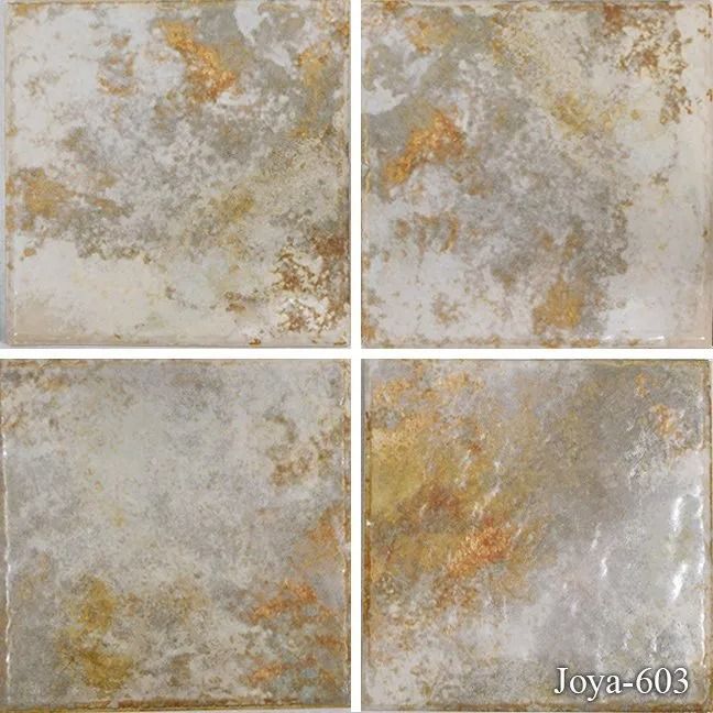 Four beige-gray marbled tile samples arranged in a 2x2 grid with gold flecks.